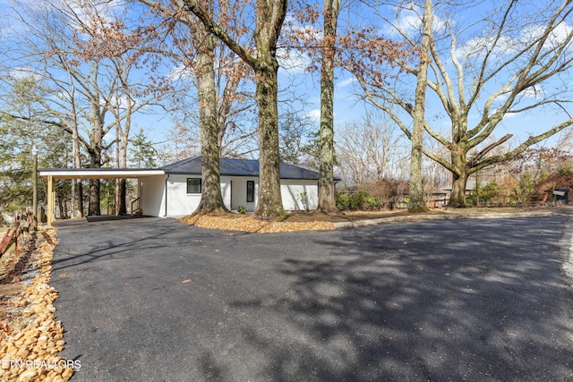 ranch-style home with a carport