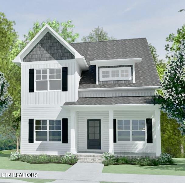 view of front of house with covered porch, board and batten siding, and a shingled roof