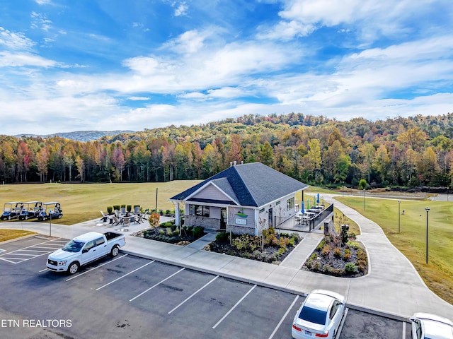 drone / aerial view featuring a view of trees