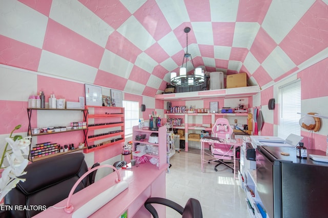 tiled office space with an inviting chandelier, plenty of natural light, and vaulted ceiling