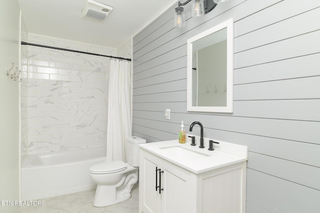 full bathroom featuring vanity, toilet, shower / tub combo, and wood walls