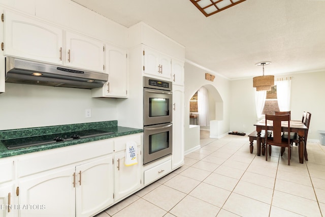 kitchen with pendant lighting, double oven, white cabinets, crown molding, and black cooktop