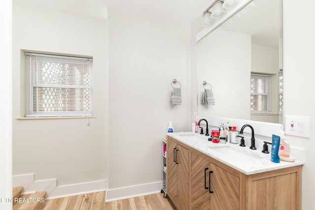 bathroom featuring vanity and wood-type flooring