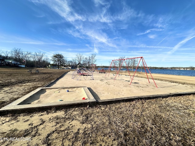 view of jungle gym featuring a water view