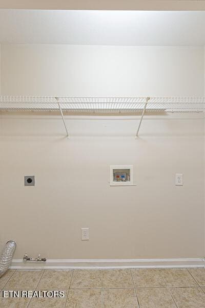 laundry room featuring gas dryer hookup, electric dryer hookup, washer hookup, and tile patterned floors