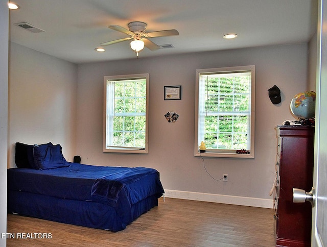 bedroom with hardwood / wood-style floors