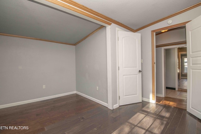 interior space featuring crown molding and dark hardwood / wood-style flooring