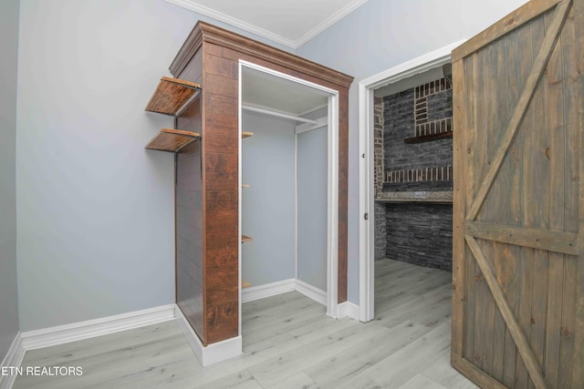 walk in closet featuring light hardwood / wood-style floors