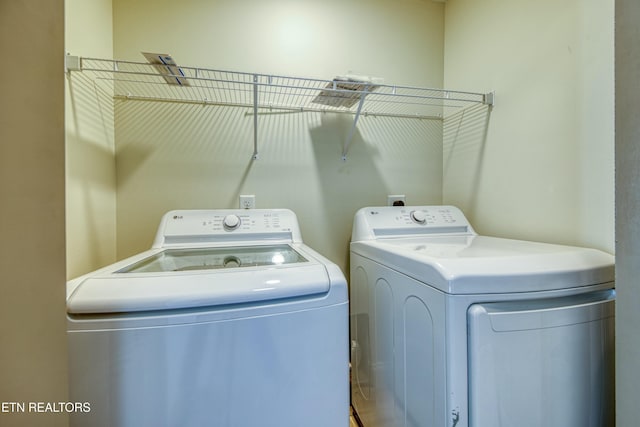 washroom with laundry area and separate washer and dryer