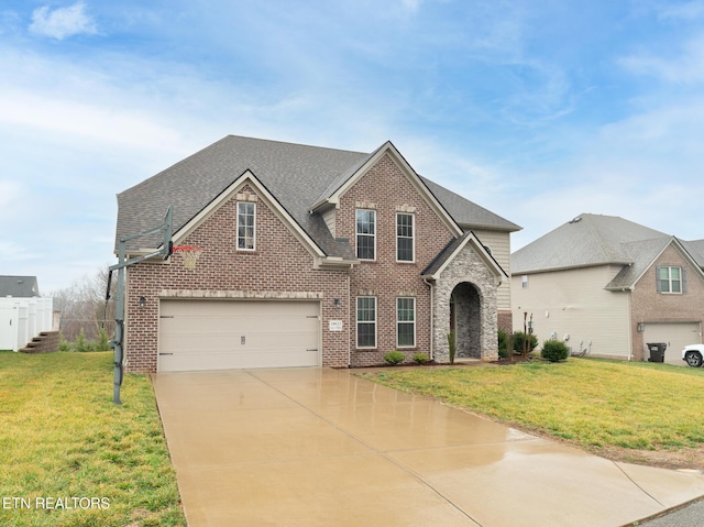 view of front of property with a garage and a front yard