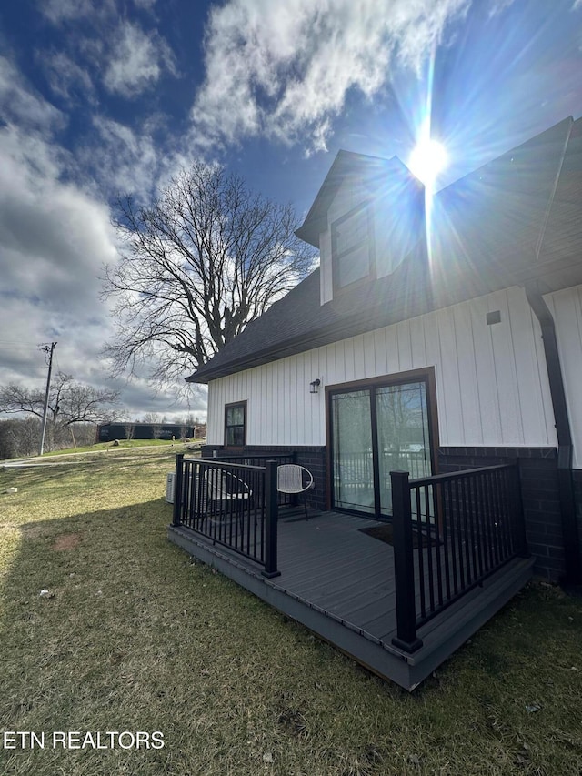 wooden deck with a yard