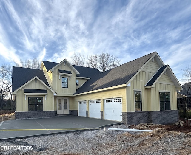 view of front of house featuring a garage and french doors