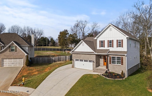 view of front of home with a front lawn and a garage