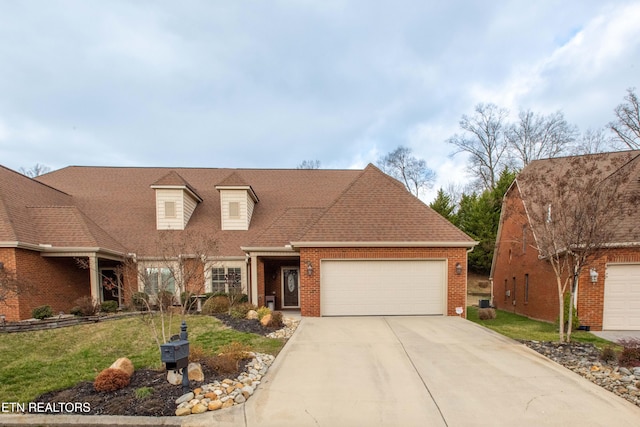 view of front of home with a garage and a front yard