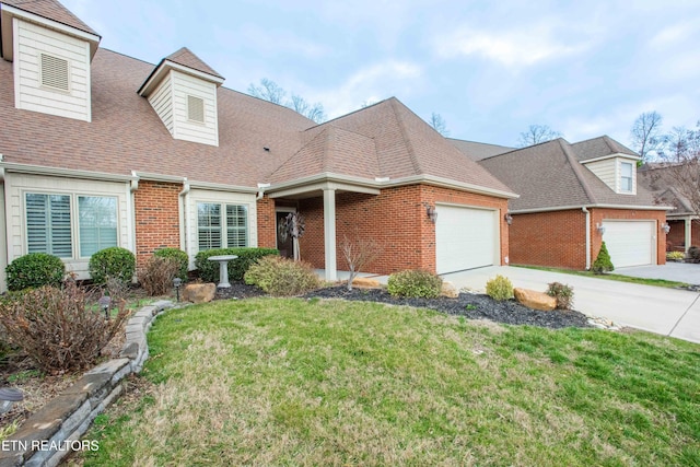 view of front of house with a garage and a front yard