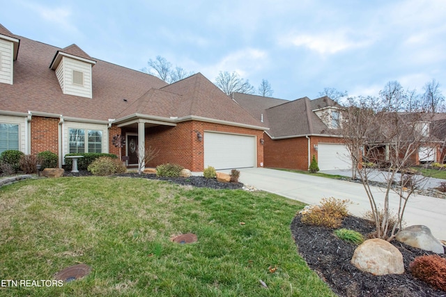 view of front of house with a garage and a front yard