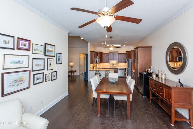 dining space with dark wood-type flooring and ornamental molding