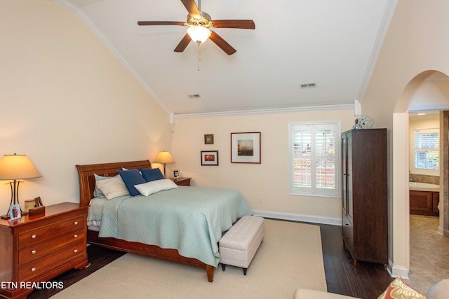 bedroom featuring multiple windows, crown molding, and lofted ceiling