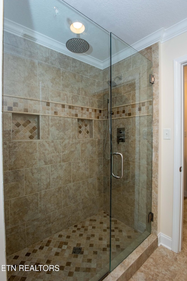 bathroom featuring crown molding and walk in shower