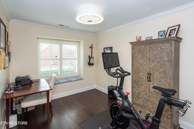 exercise room featuring ornamental molding and dark wood-type flooring