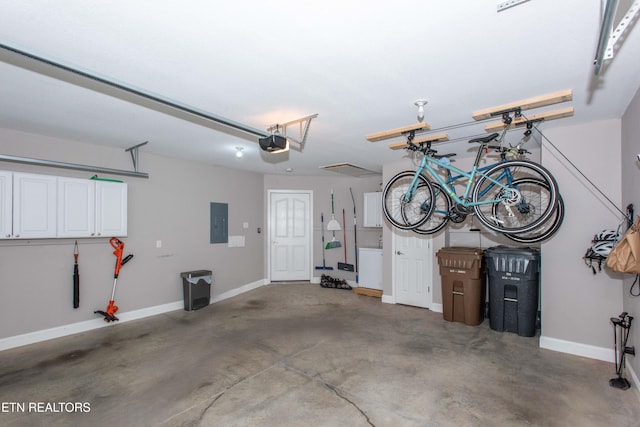 garage featuring a garage door opener and electric panel