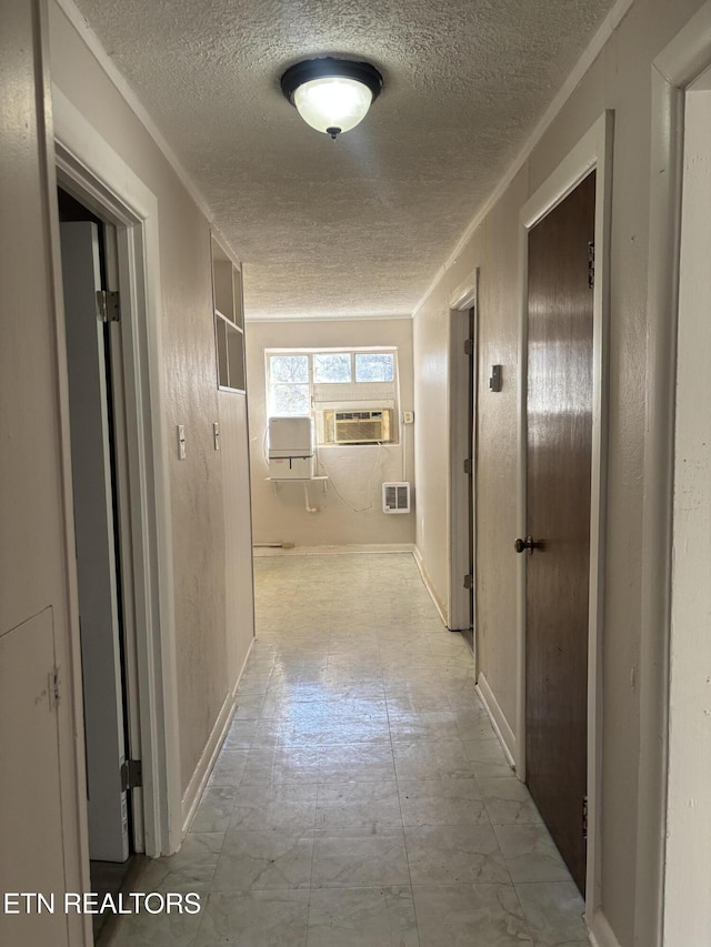 hallway with cooling unit and a textured ceiling