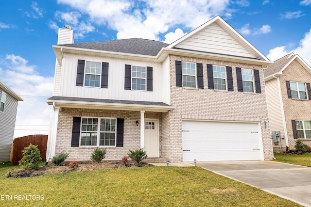 view of front of home with a garage and a front yard