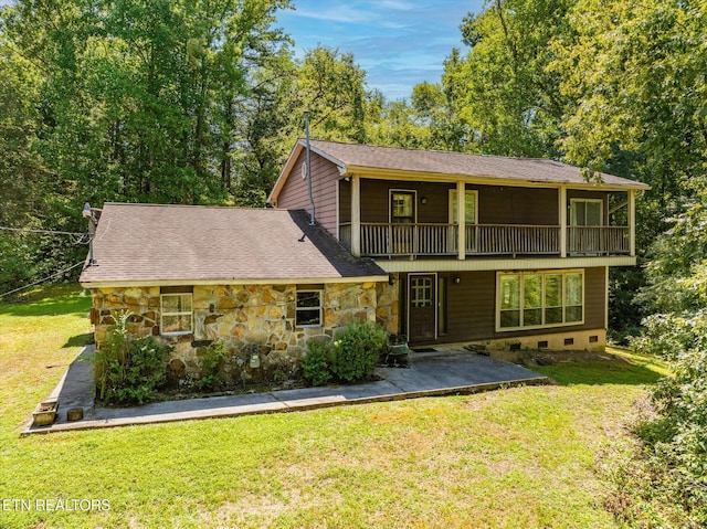 view of property with a patio area and a front yard