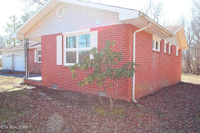 view of side of property with a garage