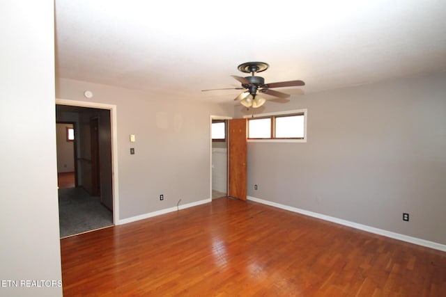 spare room featuring hardwood / wood-style floors and ceiling fan