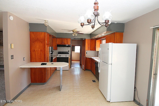 kitchen featuring tasteful backsplash, ceiling fan with notable chandelier, and white appliances