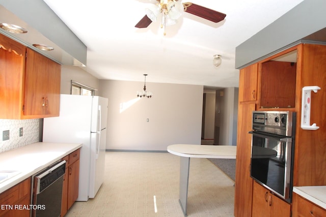 kitchen featuring ceiling fan with notable chandelier, decorative light fixtures, dishwasher, backsplash, and wall oven