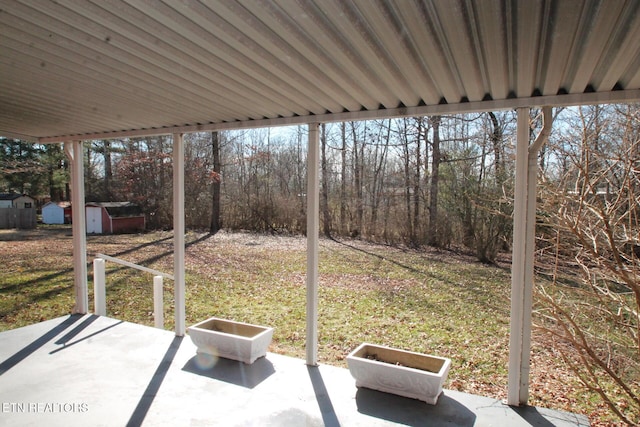 view of patio / terrace featuring a storage shed