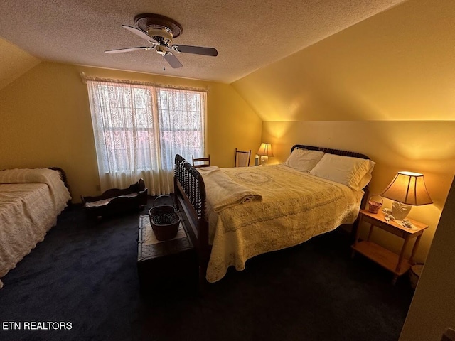 carpeted bedroom with a textured ceiling, lofted ceiling, and ceiling fan