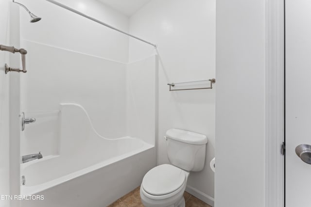 bathroom featuring shower / tub combination, tile patterned floors, and toilet