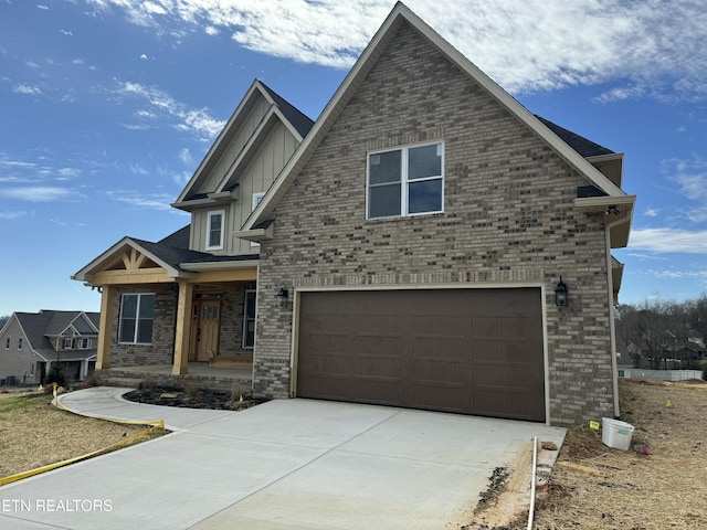 view of front of home featuring a garage and covered porch