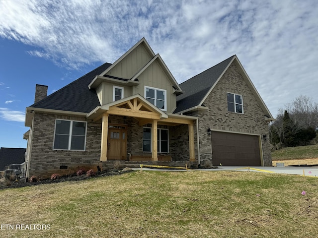 craftsman inspired home featuring a garage, covered porch, and a front yard