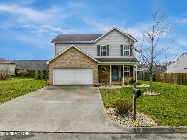 view of property featuring a garage, a front yard, and covered porch