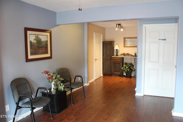 corridor with dark hardwood / wood-style floors