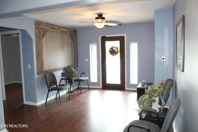 foyer with dark wood-type flooring and ceiling fan