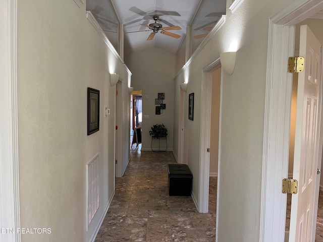 corridor with lofted ceiling