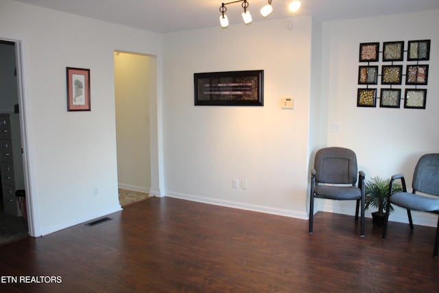 living area with dark hardwood / wood-style flooring