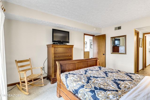 1130 Ski View Dr, Gatlinburg, TN 37738 - bedroom featuring a textured ceiling, visible vents, and baseboards