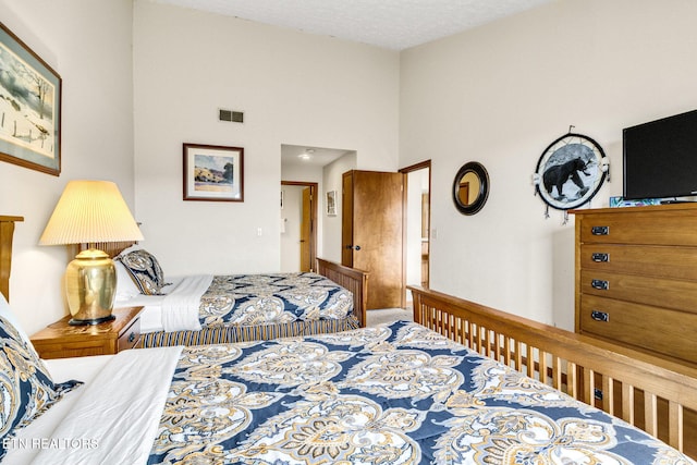 1130 Ski View Dr, Gatlinburg, TN 37738 - bedroom with visible vents and a towering ceiling
