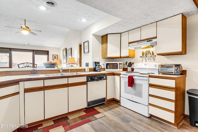 1130 Ski View Dr, Gatlinburg, TN 37738 - kitchen featuring white cabinets, white appliances, visible vents, and under cabinet range hood