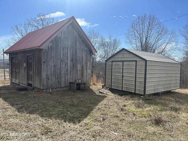 view of outbuilding featuring a lawn