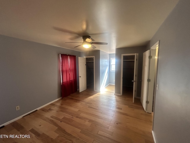 spare room featuring ceiling fan and light wood-type flooring