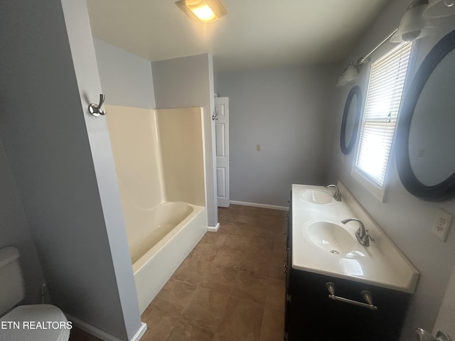 full bathroom with vanity,  shower combination, and toilet