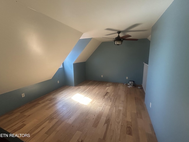 bonus room with vaulted ceiling, ceiling fan, and light hardwood / wood-style floors