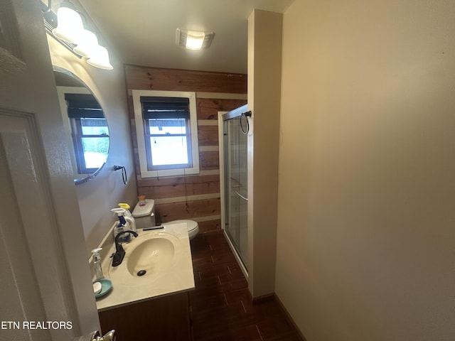 bathroom featuring an enclosed shower, hardwood / wood-style floors, vanity, and toilet